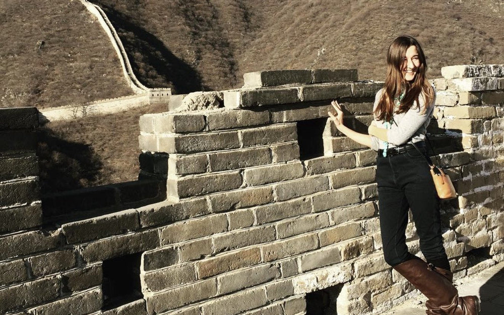 Darby Cox laughing on the Great Wall of China