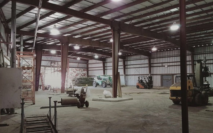 The empty Smoke Cartel warehouse, forklifts parked, before the move