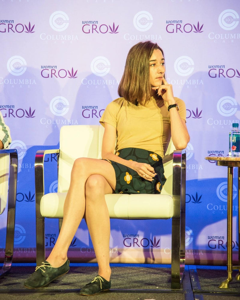 Darby Cox speaking on stage