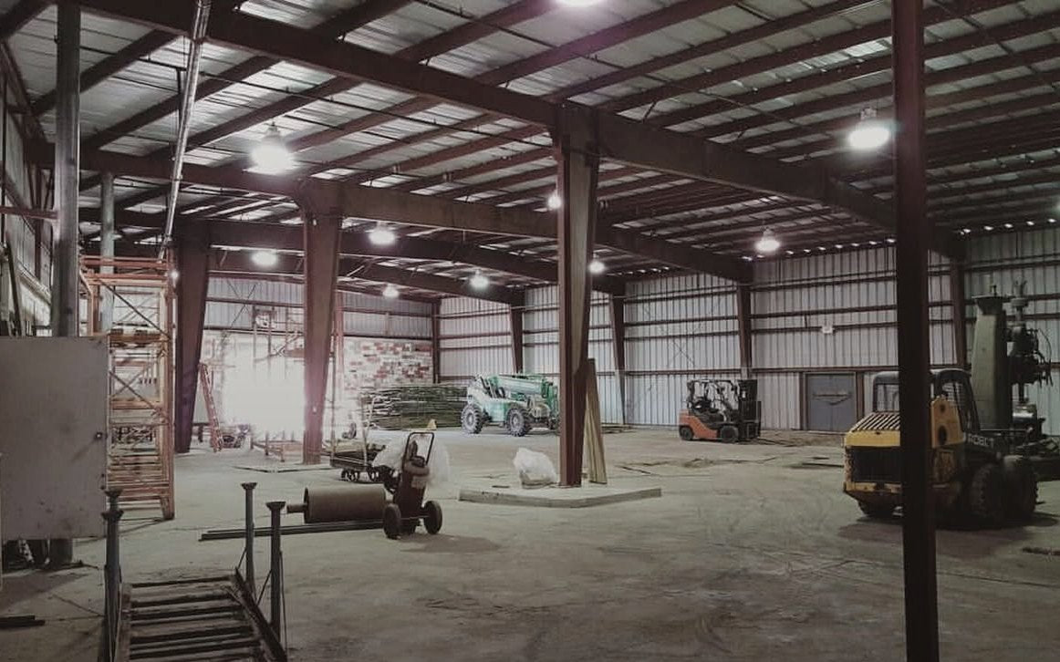 The empty Smoke Cartel warehouse, forklifts parked, before the move